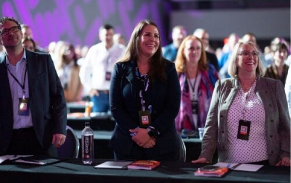 Image of a sales leader and their team at OutBound Conference